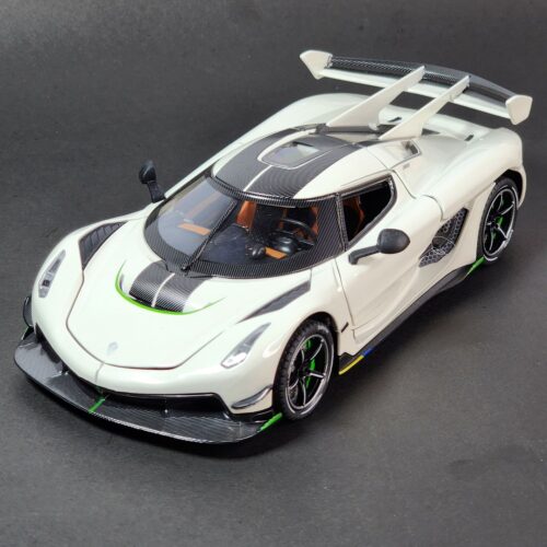 White 1:24 scale Koenigsegg Jesko style hypercar die-cast model with its signature doors and rear engine cover opened, showing carbon fiber details. Khilone for kids