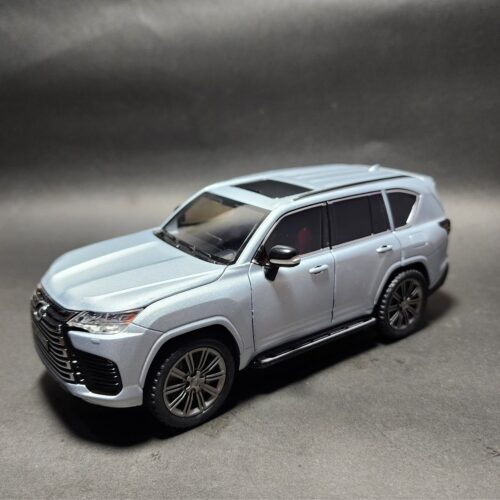 Light metallic silver 1:24 scale Lexus LX 600 SUV die-cast model car with a red interior, visible sunroof, and dark wheels. Khilone for kids